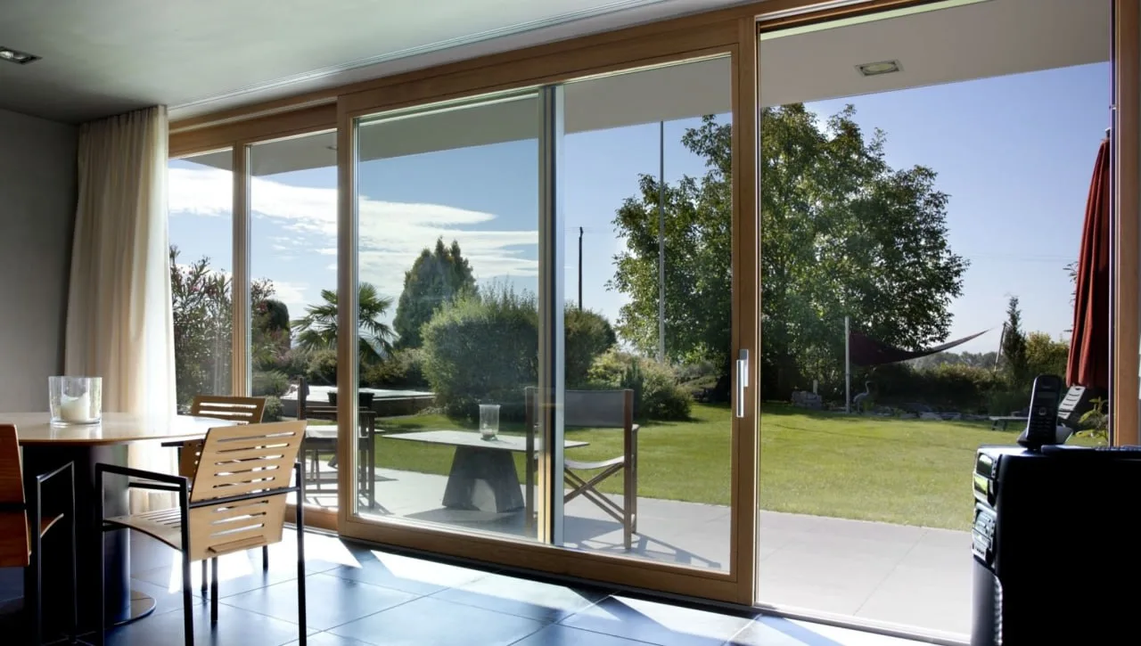 Lift-and-slide door with a threshold set into the floor